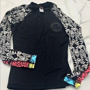 Billabong Black Rash Guard with Geometric Sleeves and Colorful Cuffs